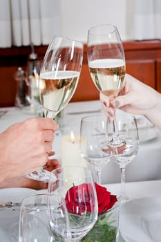 happy smiling couple in restaurant celebrate toast champagne dinner