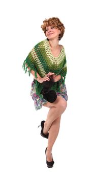 Girl in a green knit poncho, short skirt and high heels on tne white background
