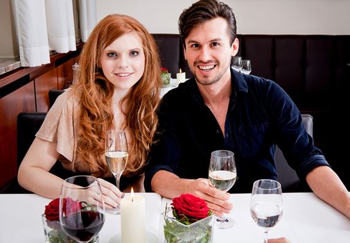 smiling happy people in restaurant drinking talking having fun 