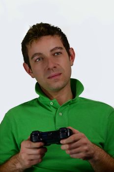 Good looking young man holding joystick (gamepad, joypad) playing video games