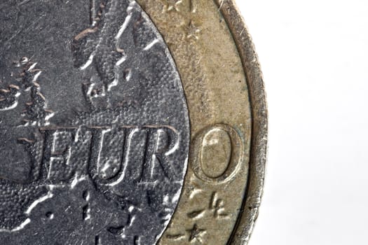 1 Euro coin macro detail over plain white backdrop