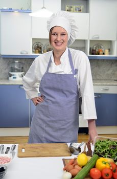 Smiling chief cook in the kitchen
