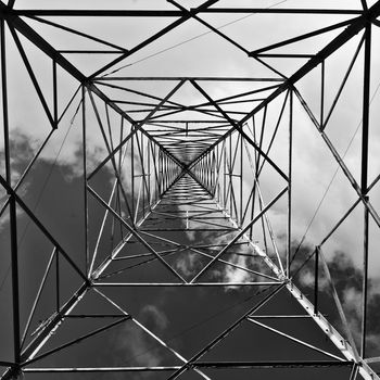 Concentric geommetrical shapes reaching out into the sky.  Abstract image shot under an old comms tower in Bahrija in Malta.