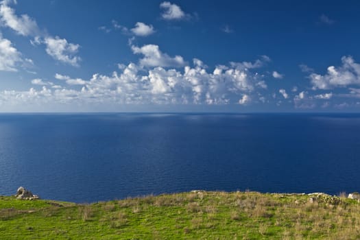 Looking out into the horizon atop the cliffs at Bahrija in Malta.