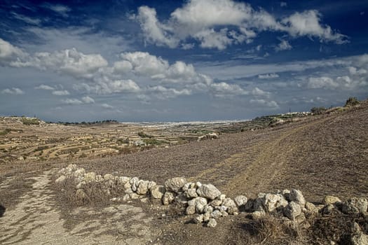 Beautiful skies over countryside view in Malta during late autumn