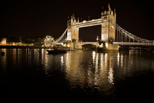 Tower bridge in London, England at night.
A famous landmark with tourists and travel