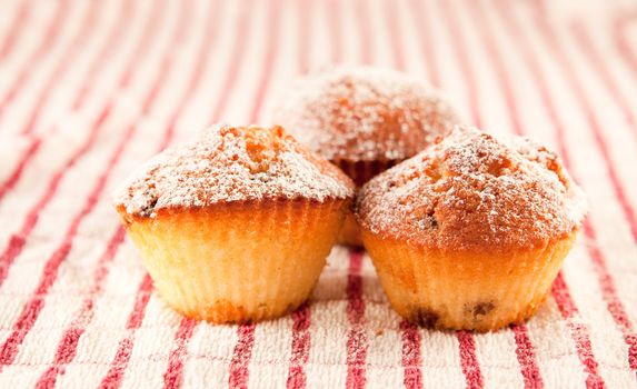 fresh muffins on a cloth