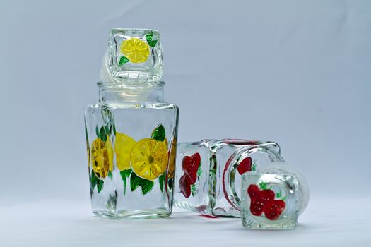 Empty decorative glass food container on bluish background