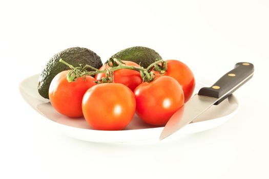 Fresh tomatoes and avocados