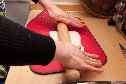 hands rolling pastry