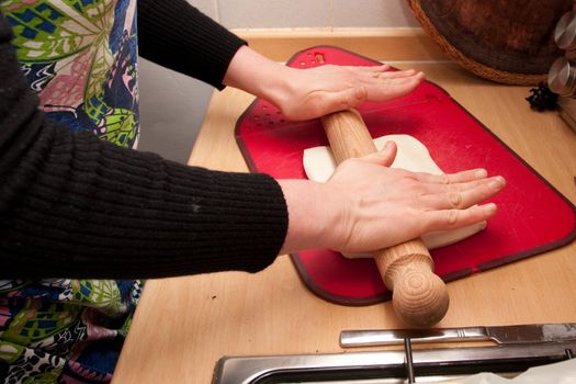 hands rolling pastry