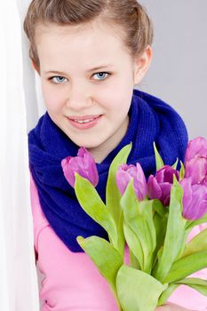 smiling teenager girl with pink tulips bouquet present gift easter mothersday valentine birthday