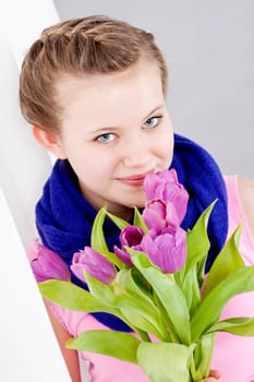 smiling teenager girl with pink tulips bouquet present gift easter mothersday valentine birthday