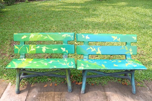 Two wooden chairs in a park