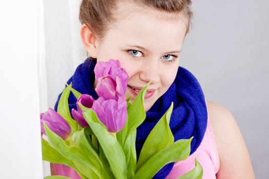 smiling teenager girl with pink tulips bouquet present gift easter mothersday valentine birthday