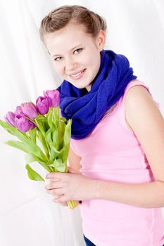smiling teenager girl with pink tulips bouquet present gift easter mothersday valentine birthday