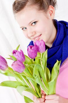 smiling teenager girl with pink tulips bouquet present gift easter mothersday valentine birthday