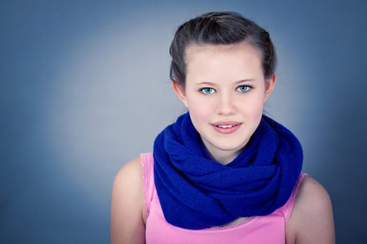 young teenager girl smiling having fun portrait blue scarf