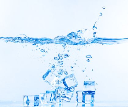 Ice Cubes Dropped into Water with Splash on white