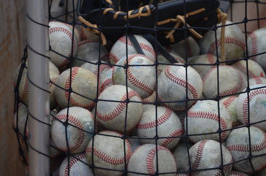 Old baseballs ready for practice at a ball field