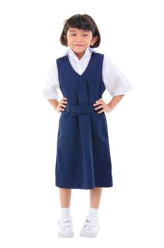 Seven years old Southeast Asian school girl in school uniform, fullbody over white background