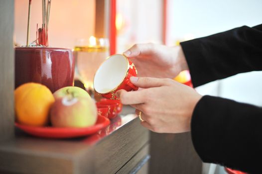 Traditional Chinese wedding tea ceremony serving to ancestor.