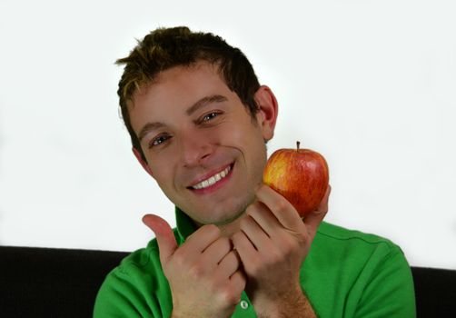 Thumb up on apple or fruits, healty living young man