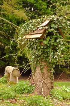 bird table overgrown with ivy
