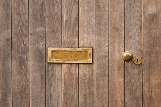 letter box in wooden door