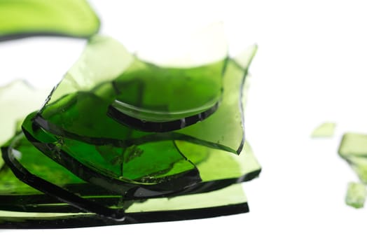 Pile of broken glass in green isolated on white