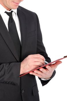 Close-up shot of a business man with clipboard and pen.