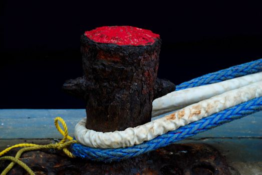 stock picture of ship ropes and structures to mooring the ship on the dock