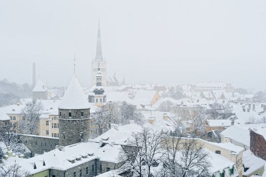 Roofs and towers in the city center in winter