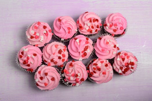 Pink Cupcakes on a Wood Background