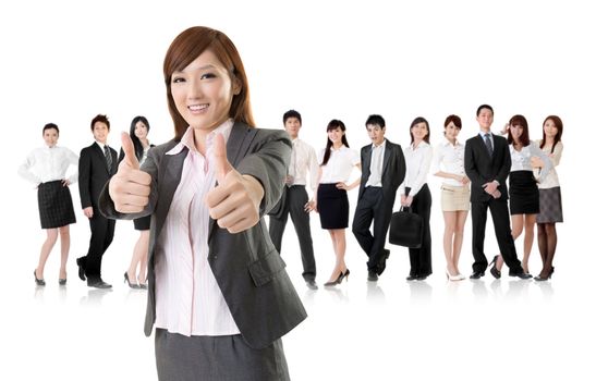 Smiling business executive woman of Asian give you an excellent sign in front of her team isolated on white background.