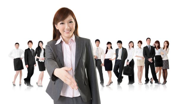 Smiling business executive woman of Asian make a handshake with you in front of her team isolated on white background.
