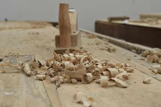 A wooden desk of a carpenter with some tools