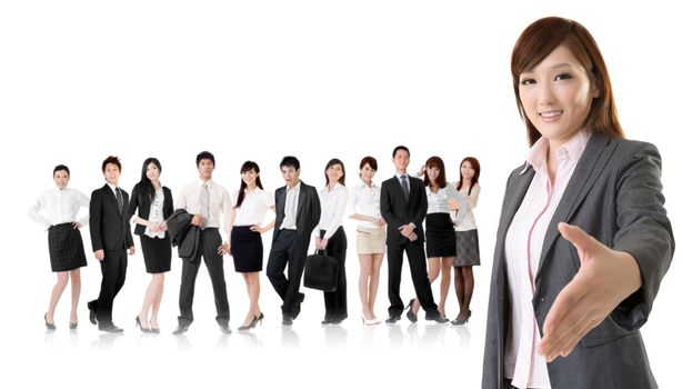 Smiling business executive woman of Asian make a handshake with you in front of her team isolated on white background.