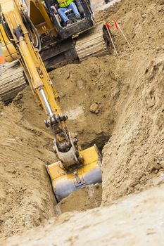 Working Excavator Tractor Digging A Trench.