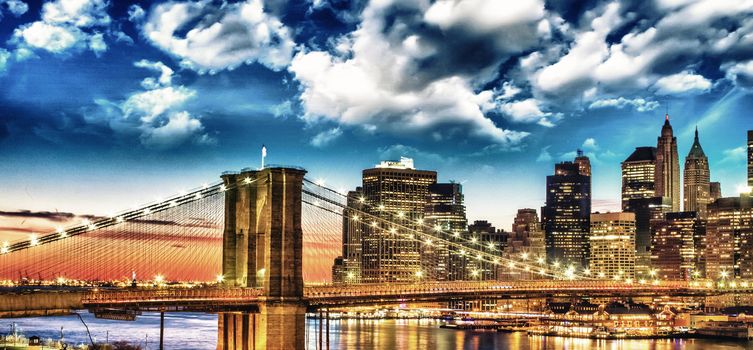 Amazing New York Cityscape - Skyscrapers and Brooklyn Bridge at sunset - USA