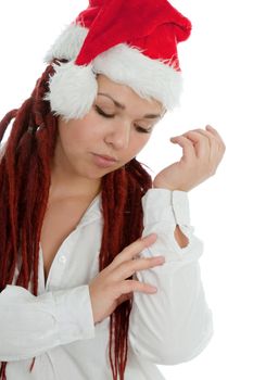 Portrait of young modern girl wearing Santa Claus hat isolated on white background.