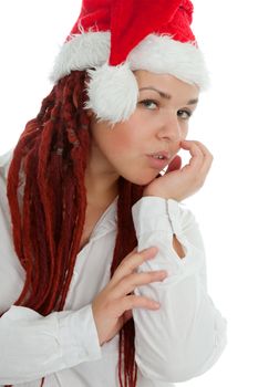 Portrait of young modern girl wearing Santa Claus hat isolated on white background.