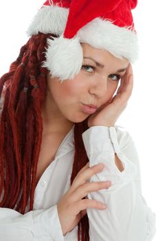 Portrait of young modern girl wearing Santa Claus hat isolated on white background.