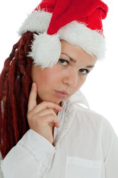 Portrait of young modern girl wearing Santa Claus hat isolated on white background.