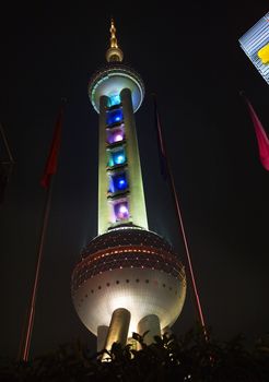 Shanghai TV Tower at Night Pudong China 

Trademarks removed.  Resubmit--In response to comments from reviewer have further processed image to reduce noise, sharpen focus and adjust lighting.
