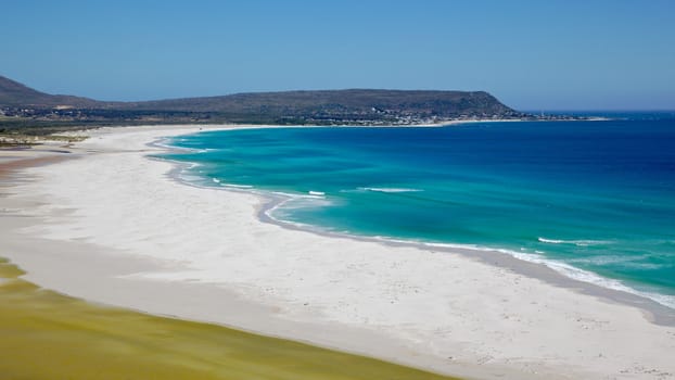 The expanse of Long Beach, with Kommetjie in the background, Cape Peninsula, South Africa.
