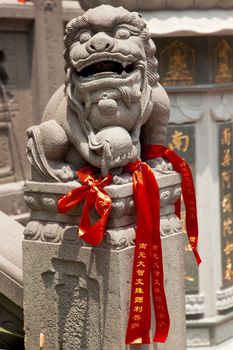 Stone Dragon Red Ribbons Buddhist Sayings Jade Buddha Temple Jufo Si Shanghai China Most famous buddhist temple in Shanghai