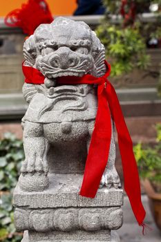 Stone Dragon Red Ribbons Buddhist Sayings Jade Buddha Temple Jufo Si Shanghai China Most famous buddhist temple in Shanghai