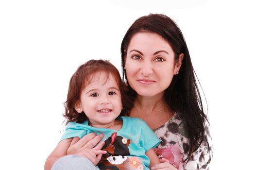 Smiling embracing mom and daughter looking at camera