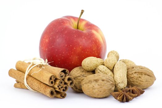 apple, cinnamon sticks and nuts